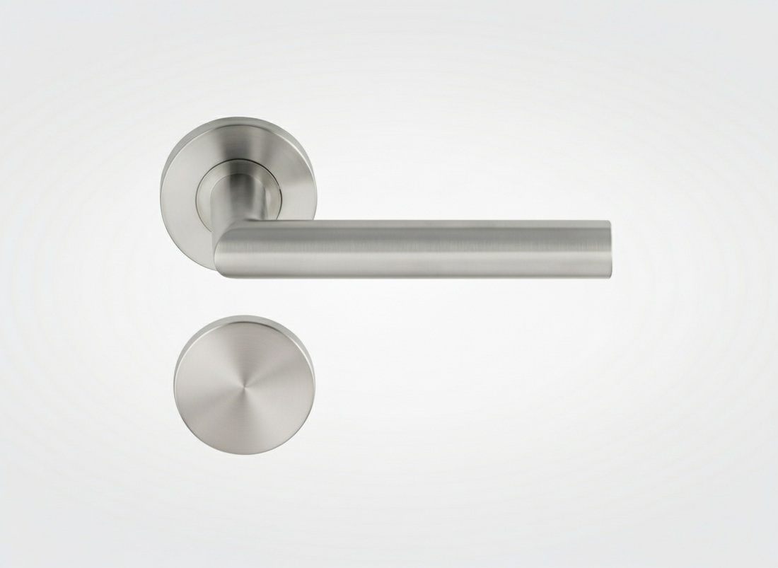 Brushed stainless steel door handle with closed PC rosette